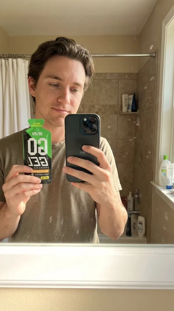 Person in photo holding product with one hand