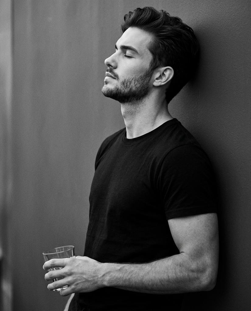 Cinematic Monochrome Side Profile Wall Lean Introspection Portrait