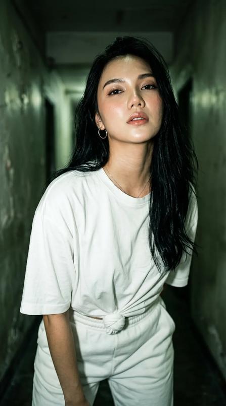 Narrow Green Hallway Oversized White Tee Cinematic Portrait