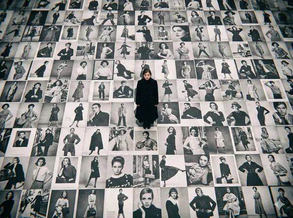 Model Standing on Black & White Billboards
